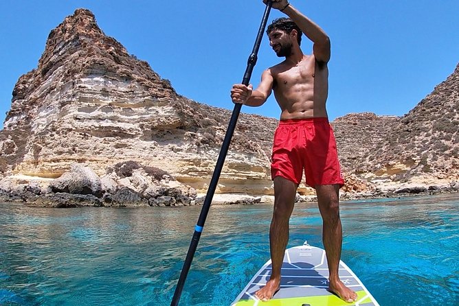 7 hours Boat trip to Lampedusa lunch, SUP and Snorkeling - The migration monument on the return