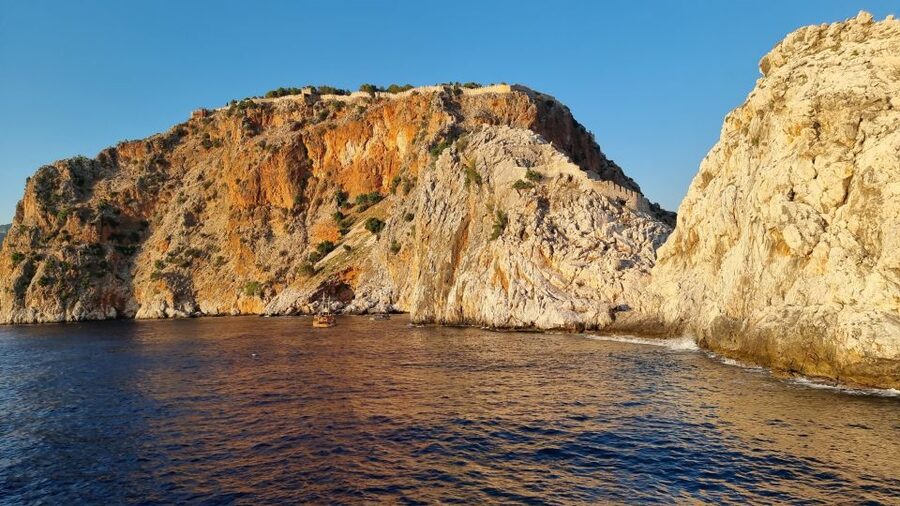 Alanya: Catamaran Boat Trip with Swim Stops and Sunbathing - Setting out from Alanya Harbor near the Red Tower