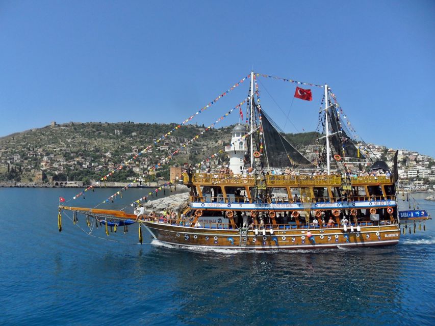Alanya Pirate Boat Trip with Lunch, Swimming & Foam Party - Leaving Alanya Harbor beside the Red Tower