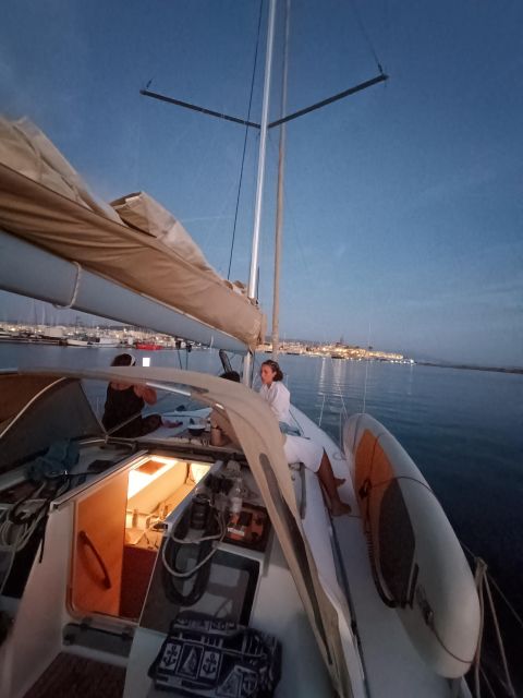 Alghero: Sunset Sailing Aperitif Experience - Across the bay toward Maddalenetta