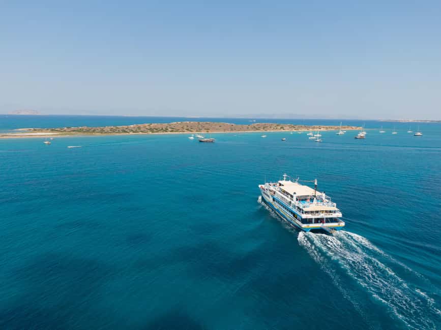 Athens: Islands Swimming Day Cruise. DJ, Lunch & Drinks inc. - Aegina combines harbor time with local flavor