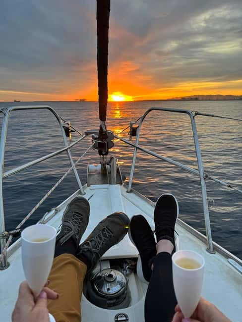 Barcelona: Sunset Sailboat Cruise with Open Bar and Snacks - An hour beside Barceloneta Beach