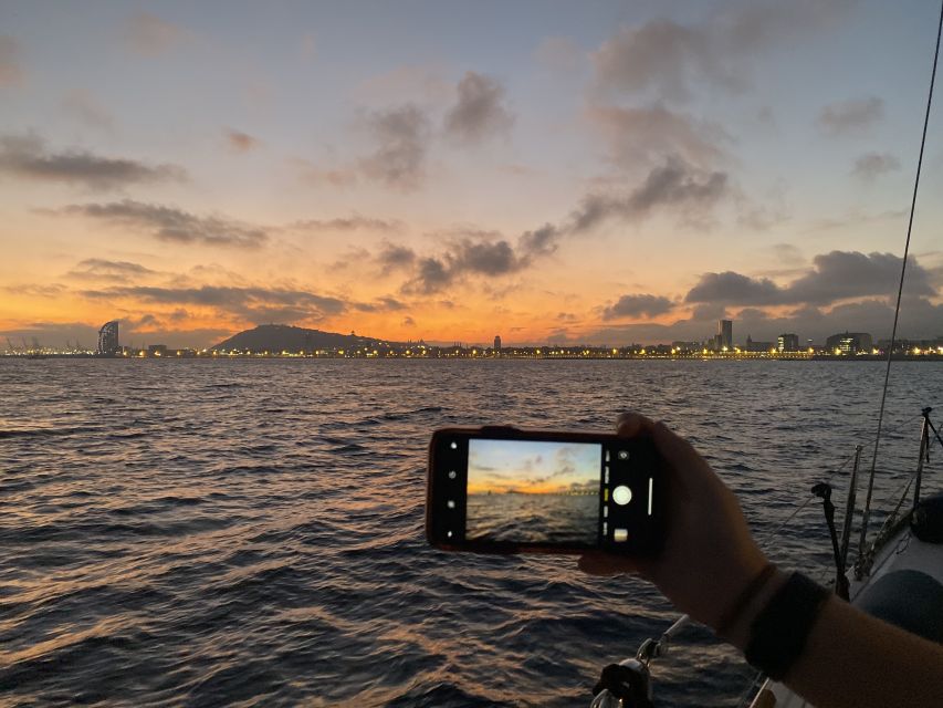 Barcelona: Sunset Sailing Tour with Open Bar & Snacks - What the skipper adds to the evening