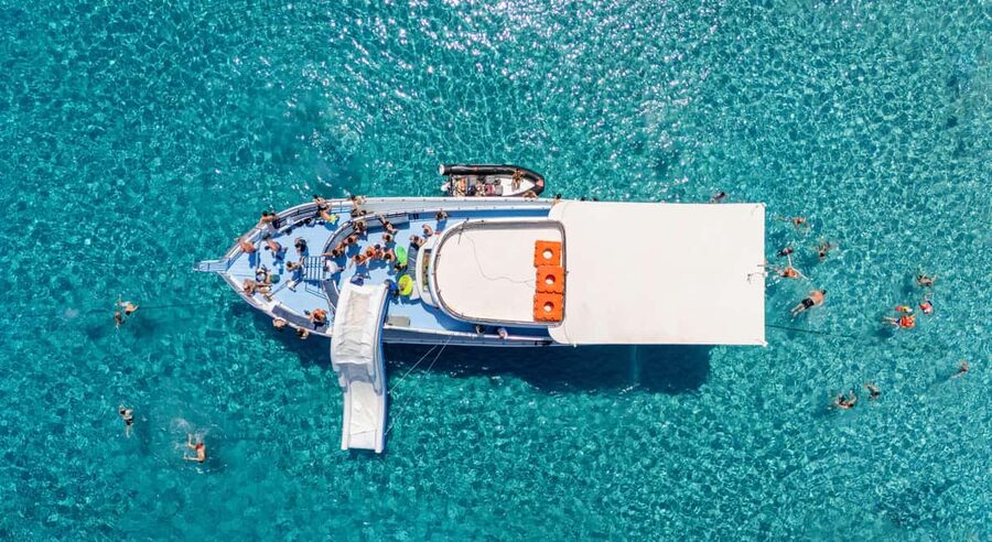 Blue Lagoon Cruise: Waterslide Adventure from Latchi Harbour - Wine, fruit, and the onboard bar
