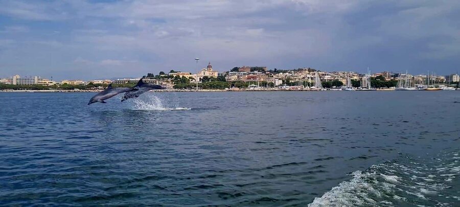Cagliari: Boat Tour, 4 Stops, Swim, Snorkeling, & 1 Spritz - Finding Bacan Cagliari and boarding the boat