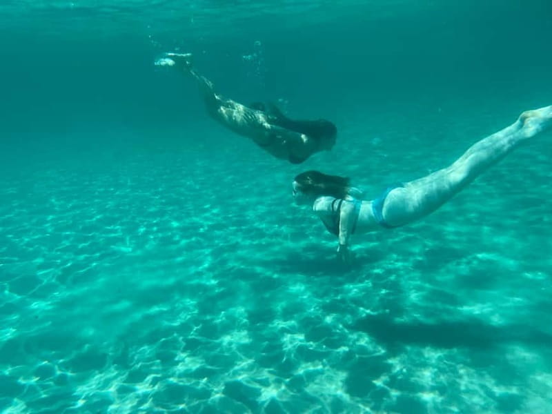 Cagliari: Boat Tour with 4 Swim Stops, Snorkeling & Prosecco - Poetto, dolphins, and the ride back