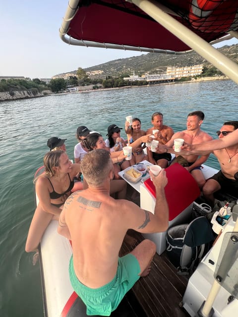 Cagliari: Devil's Saddle Boat Tour with Spritz and Chips - Cala Fighera brings cliffs and a quieter mood