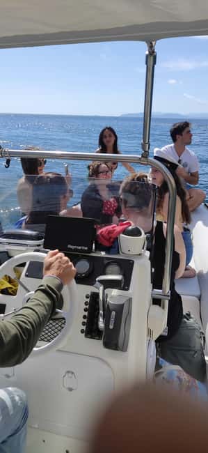Cagliari: Sella del Diavolo Boat Magic Tour Drinks & Snacks - Cala Bernat and the fish-filled water
