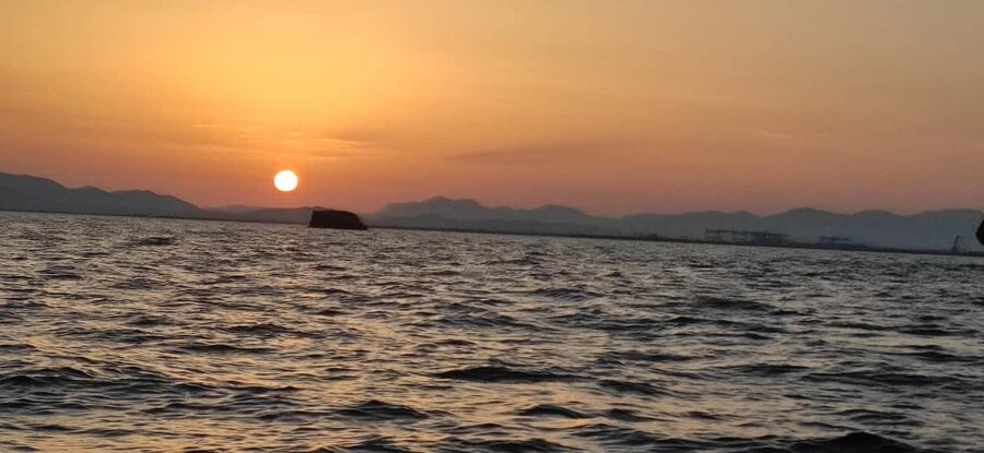 Cagliari: Sella del Diavolo Boat Magic Tour Drinks & Snacks - Sardinian snacks, drinks, and music on board