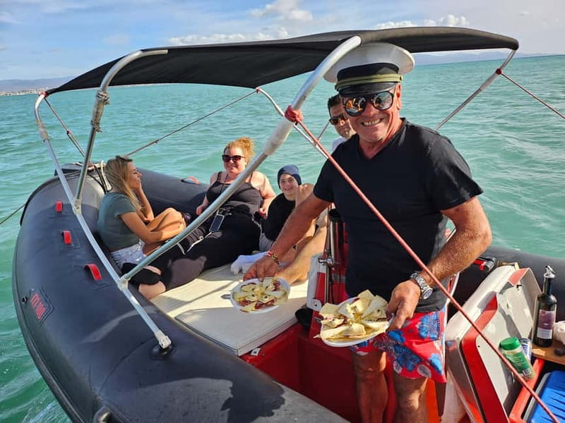 Cagliari: Sella del Diavolo Boat Magic Tour Drinks & Snacks - Captain Valter and the human side of the trip