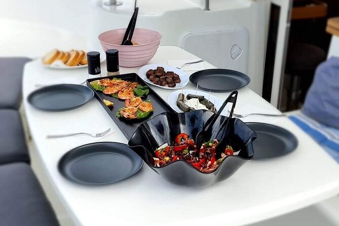 Catamaran Day & Sunset Cruises with meals Drinks and transportation - Leaving Mykonos Port for the Aegean