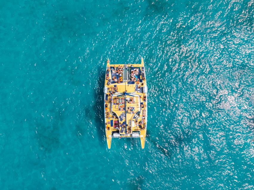 Comino: Blue Lagoon Catamaran Cruise with Lunch and Open Bar - Sailing south toward Comino