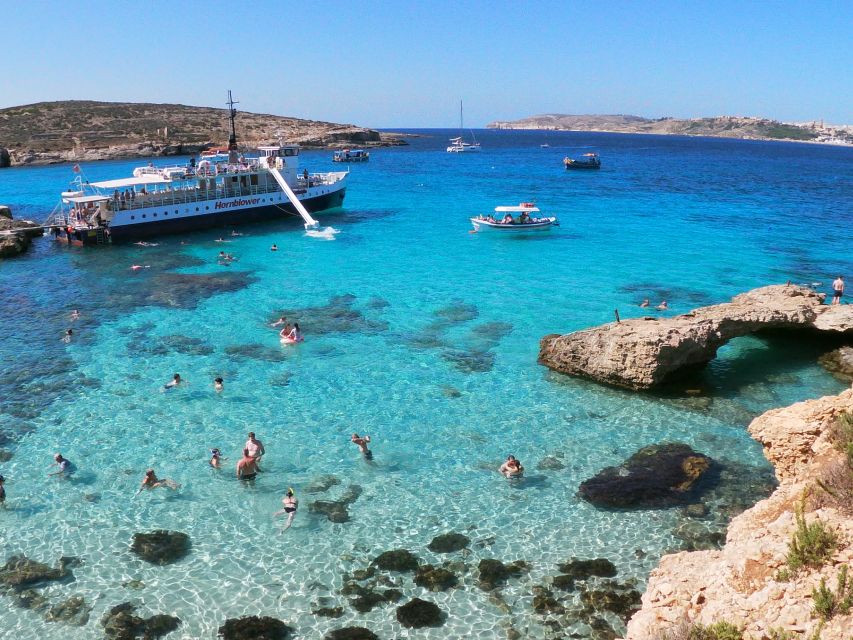 Comino: Blue Lagoon & Caves Boat Cruise - The slide, jumping points, and deck chairs