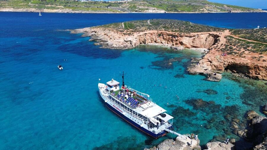 Comino: Blue Lagoon & Caves Boat Cruise - Food, drinks, and the pineapple cocktails