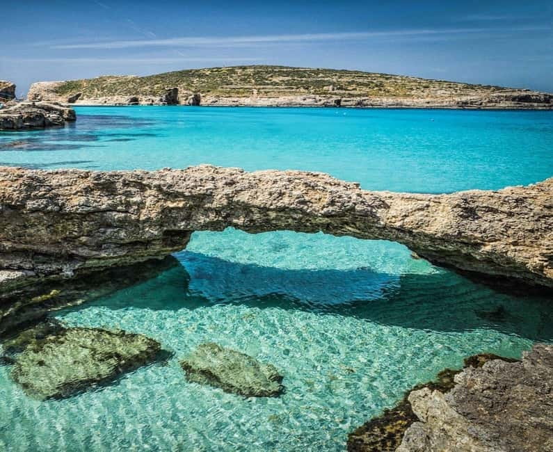 Comino & Gozo: Blue & Crystal Lagoons Cruise with Sea Caves - Leaving Ċirkewwa and passing Comino Tower