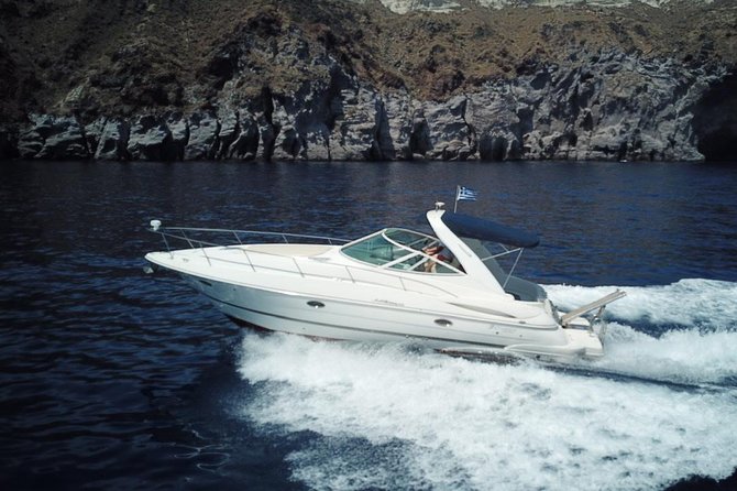 Explore Santorini’s volcano with Alex Private Boat Rental - Seeing Oia from below