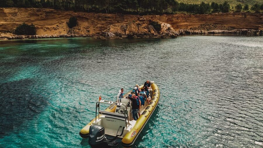 From Can Picafort: Dolphin Watching and Cave Boat Trip - Finding the grey speedboat in Can Picafort