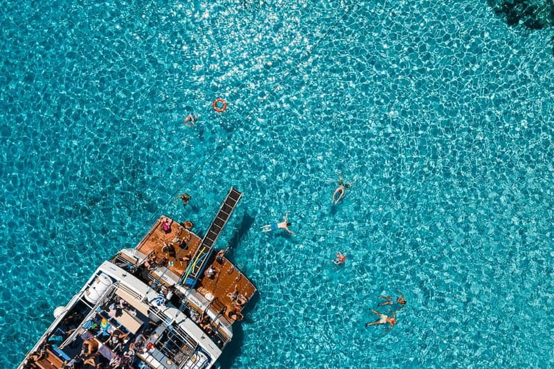 From Corfu: Day Cruise to Paxos, Antipaxos, & the Blue Caves - Entering the Blue Caves