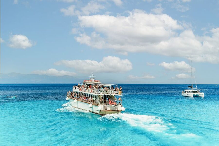 From Corfu Island: Antipaxos & Paxos Blue Caves Boat Cruise - The ride home is part sightseeing, part party