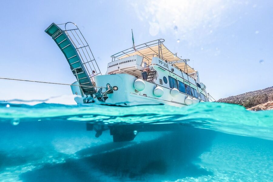 From Sardinia: La Maddalena Archipelago Full-Day Boat Tour - Claudia, multilingual explanations, and the crew