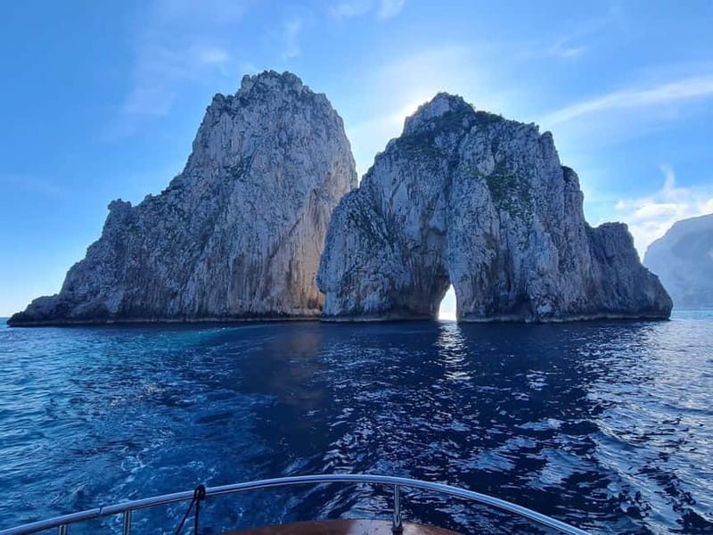 From Sorrento: Capri Boat Tour with Blue Grotto Visit - Capri’s coast, from lighthouse to Faraglioni