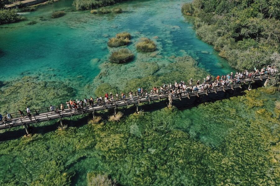 From Split: Krka Waterfalls Tour with Boat Cruise & Swimming - A panoramic boat ride toward Skradin