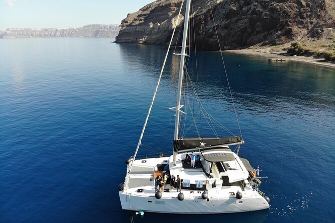 Half-Day Exclusive Catamaran Cruise in Santorini with Meal and Open Bar - Starting at Vlychada Marina with a hotel pickup