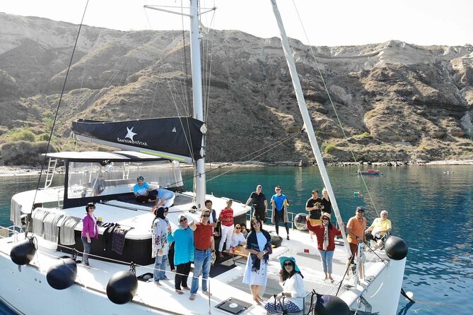 Half-Day Exclusive Catamaran Cruise in Santorini with Meal and Open Bar - Swimming near the volcano and hot springs