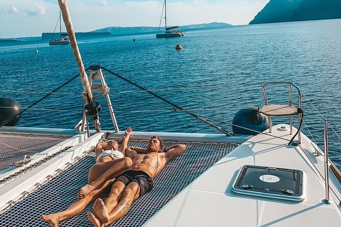Half Day Premium Catamaran Cruise in Santorini including Oia - The Venetian lighthouse and the changing caldera views