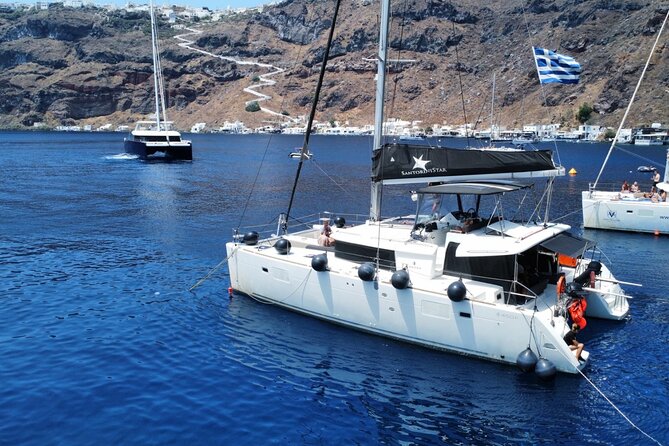 Half Day Premium Catamaran Cruise in Santorini including Oia - Red Beach, with only 25 minutes to swim
