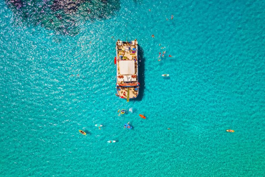Ibiza: Beach Hopping Cruise w/ Paddleboard, Food, & Drinks - Cala Tarida and the open-water stop