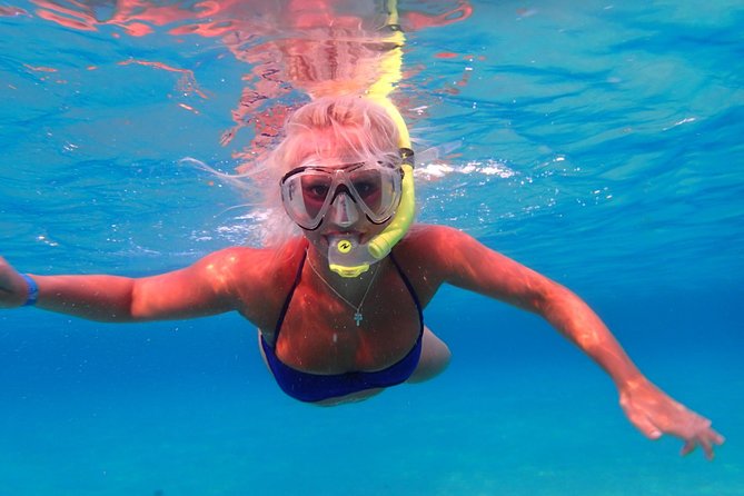 Ibiza Snorkeling Beach and Cave Tour - Cala Conta and sandy-bottom snorkeling