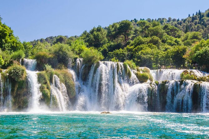 Krka Waterfalls tour with Boat Ride and Swimming in Skradin town - Walking the wooden paths around Krka