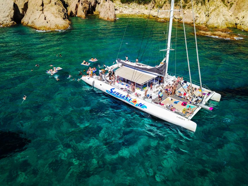 Lloret de Mar: Catamaran Sailing Cruise with BBQ and Drinks - Music, dancing, and the return to Lloret