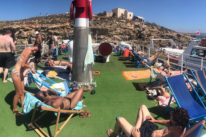 Malta: Comino, Blue Lagoon & Caves - swim, snorkel & slide - A full day on the water from Bugibba