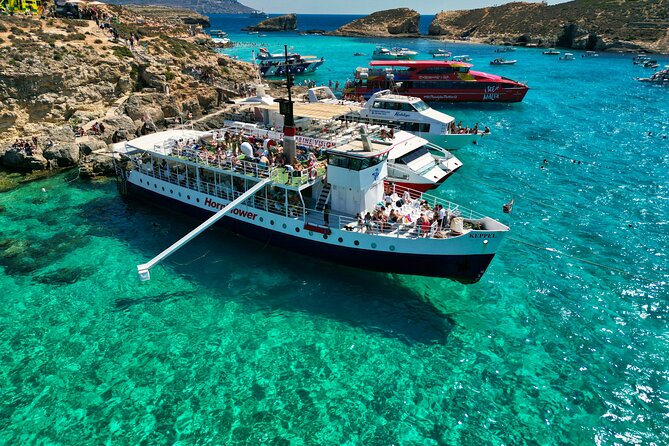 Malta: Comino, Blue Lagoon & Caves - swim, snorkel & slide - Cruising around Comino’s cliffs