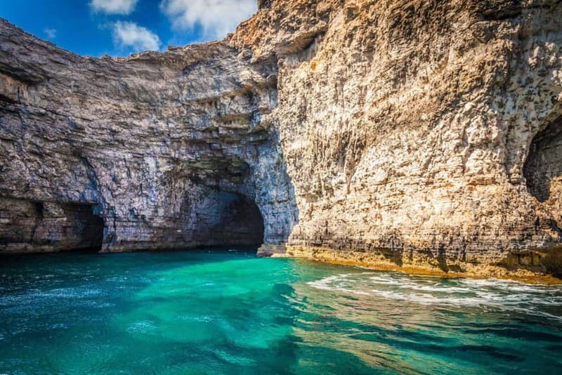 Malta: Comino, Gozo, Blue & Crystal Lagoon, and Caves Cruise - The first coastal views: Elephant Rock and Comino’s caves