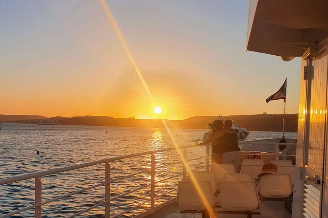 Malta Sunset Boat Tour: Bugibba to Comino Blue Lagoon Cruise - Food, cocktails, and the return under the stars