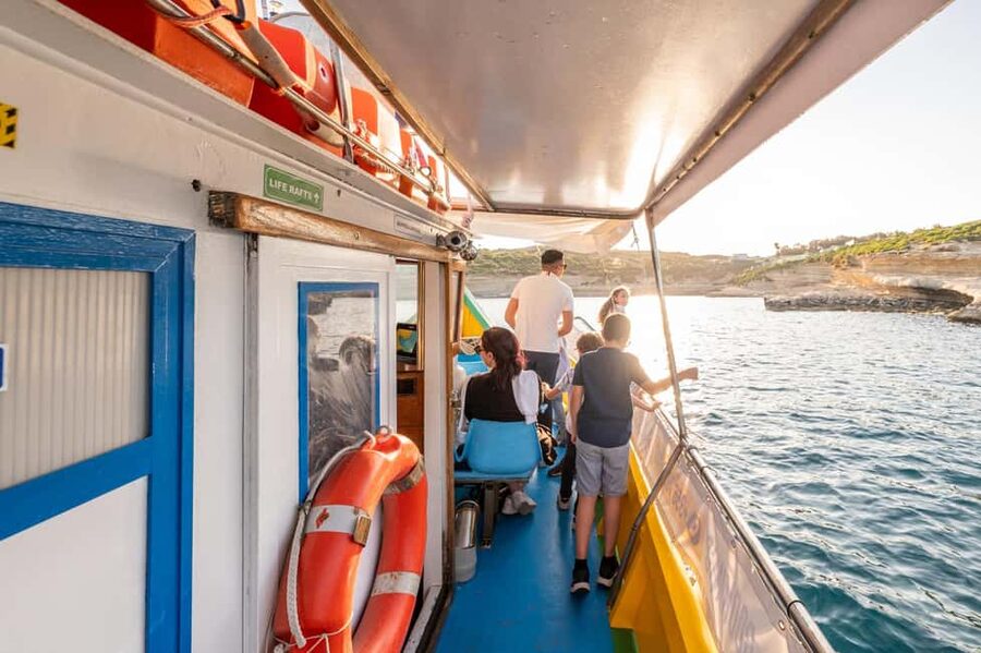 Malta: Sunset Boat Tour to St. Peter’s Pool and South Coast - Marsaxlokk Lighthouse and the return view