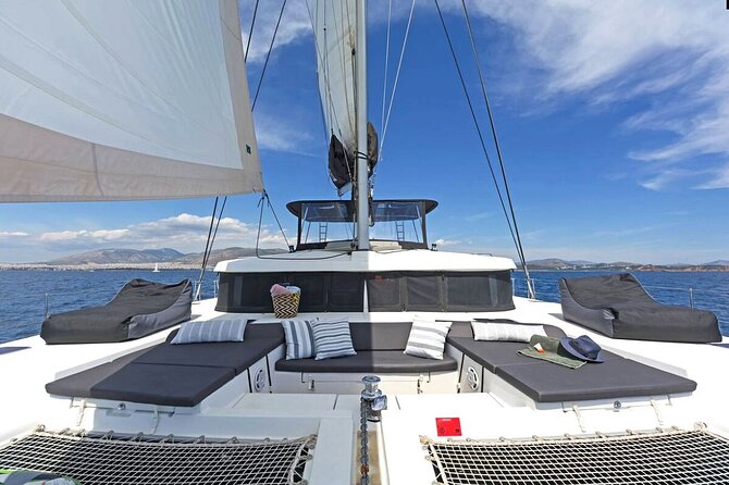 Mykonos Catamaran Premium Day-Sunset Tours 8-flavor Meal & Drinks - Sailing toward Rineia’s quiet coves