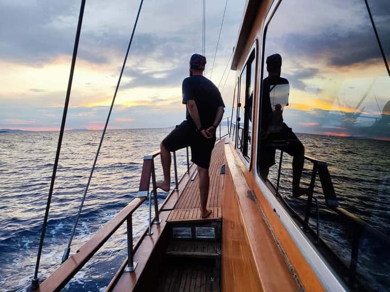Mykonos: Sunset Boat Cruise with Light Dinner & Drinks - Psarou and Platis Gialos from the water