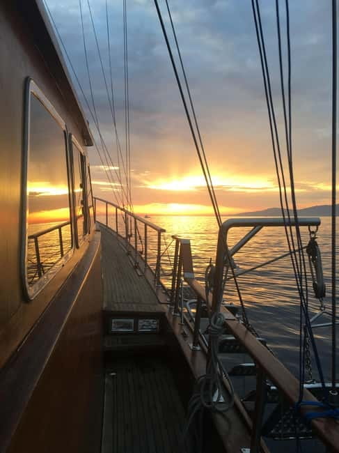 Mykonos: Sunset Boat Cruise with Light Dinner & Drinks - Super Paradise and a second swim