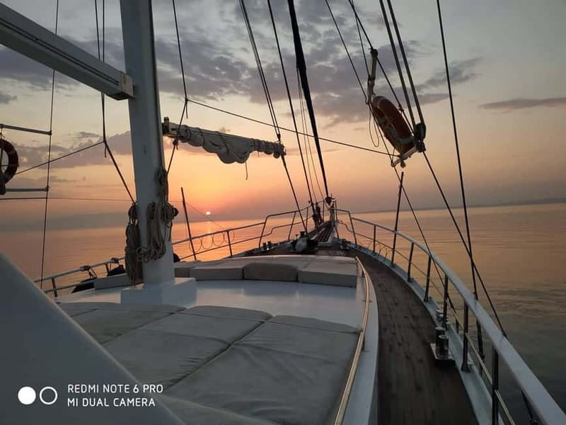 Mykonos: Sunset Boat Cruise with Light Dinner & Drinks - Dinner arrives as the light turns gold
