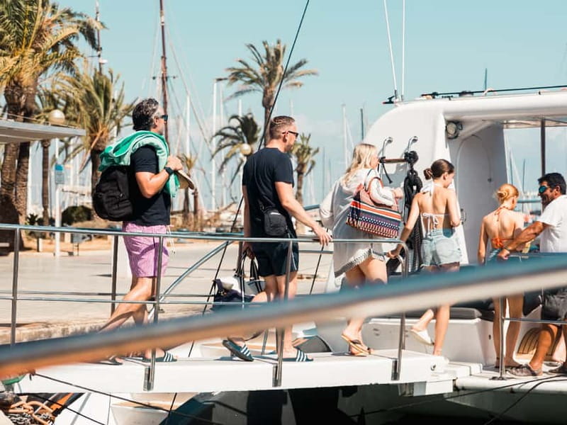 Palma de Mallorca: Half-Day Catamaran Tour with Buffet Meal - Sailing south from Palma’s marina