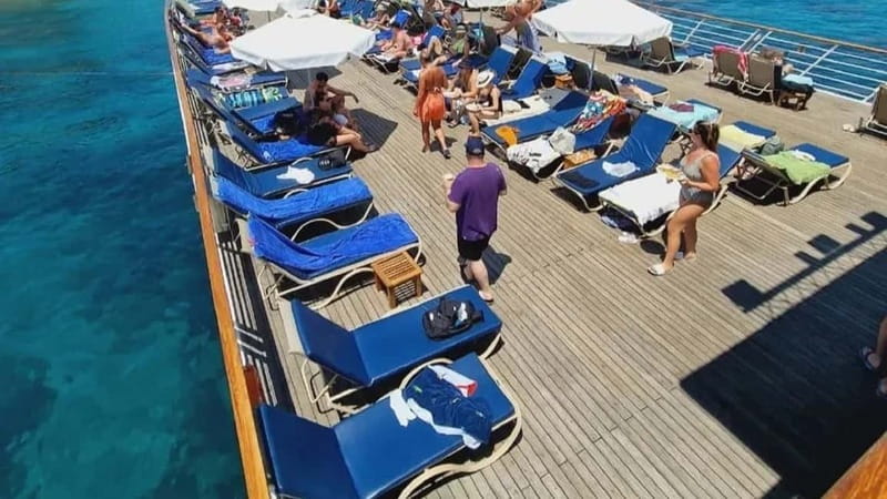 Paphos: Wave Dancer Sunset Cruise with BBQ and Swimming - Leaving Paphos Harbour for Riccos Bay