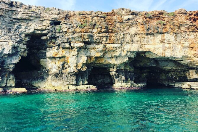 Polignano a Mare boat tour emotions, caves, diving and appetizers - Lama Monachile and the final aperitivo