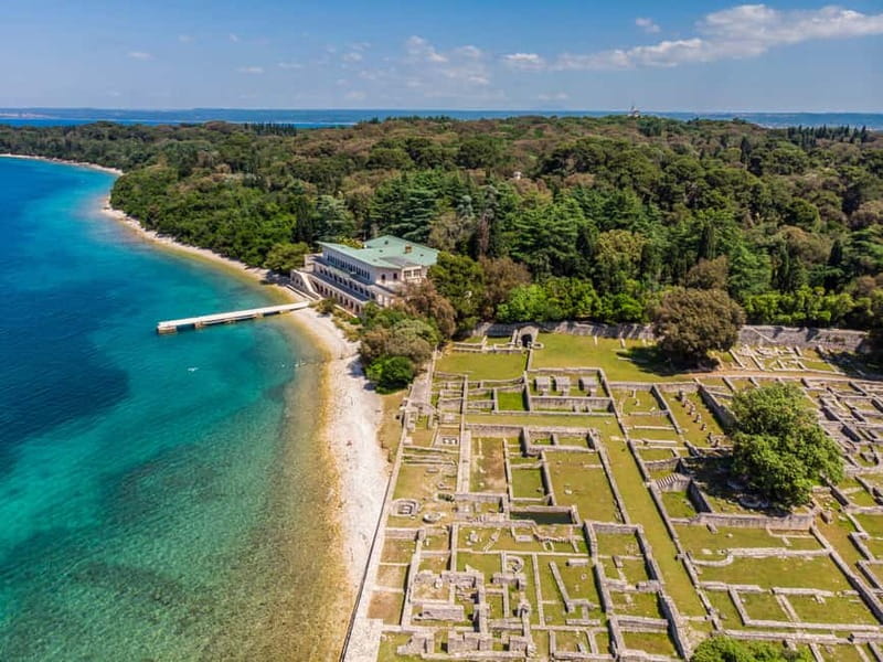 Pula: All-Inclusive Brijuni Boat Tour w Lunch, Drinks & Swim - Setting out beneath Pula’s Roman Amphitheater