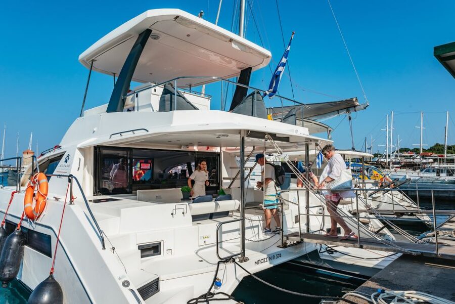 Rhodes: Sunset Catamaran Cruise with Dinner Buffet & Drinks - Leaving Mandraki Harbor for the east coast