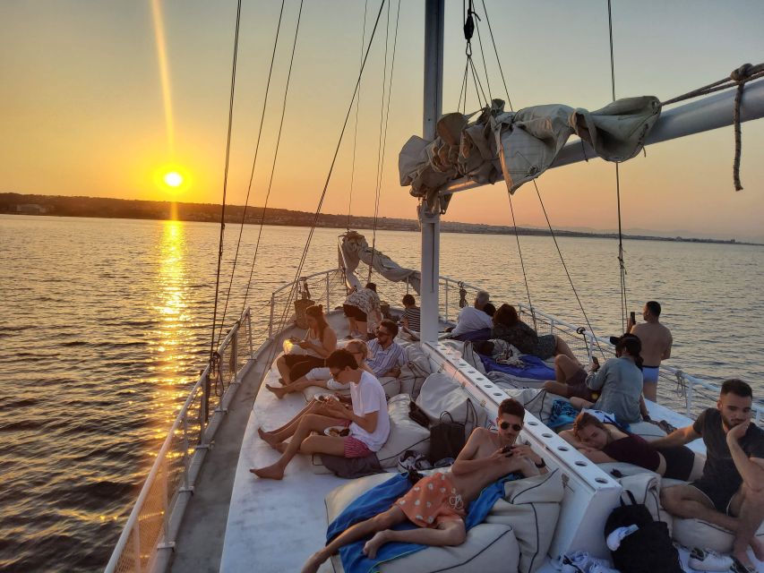 Rhodes: Sunset Cruise with Open Bar, Dinner, & Live Music - Dinner, drinks, and the sunset