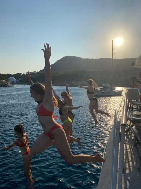 Rhodes: Sunset Cruise with Open Bar, Dinner, & Live Music - Rhodes’ east coast from the water